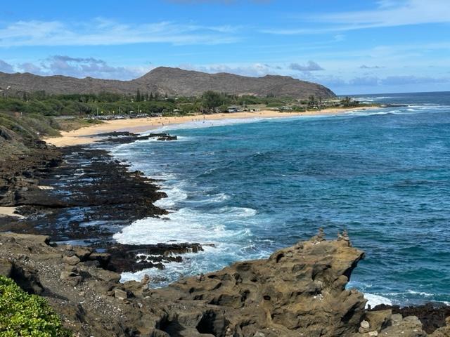 Rocky oceanic coastline with road photo with photo by Hawaii Concierge Couseling by Bruce Berger