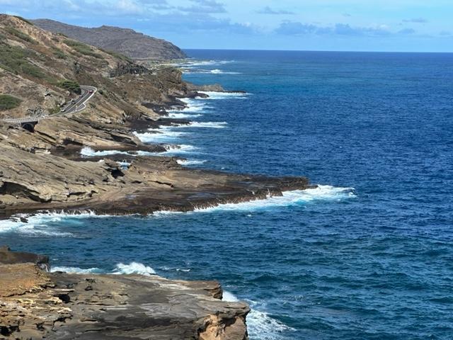 Rocky ocean coastline with road photo with photo by Hawaii Concierge Couseling by Bruce Berger